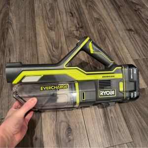 Ryobi Cordless Handheld Vacuum. Comes with wall mounted charger and accessories